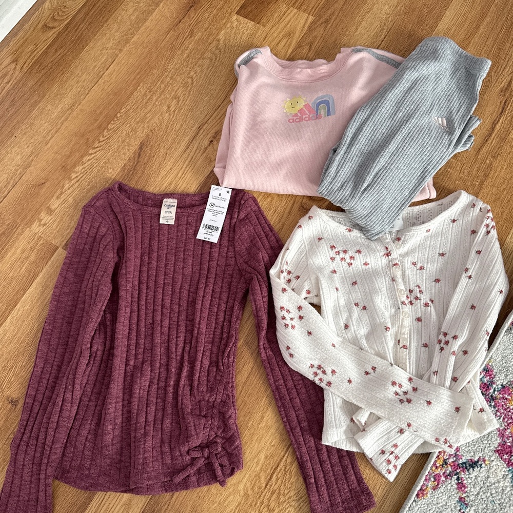 Two long sleeve kids shirts and one outfit